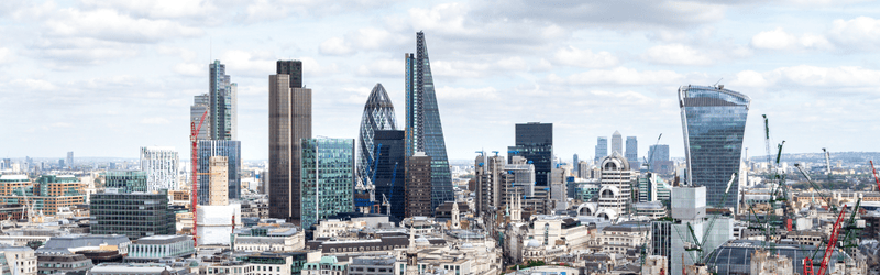 can i buy a house in the uk while living abroad, view of London's skyline on a sunny day